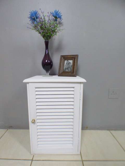 A stylish painted white pedestal w/ slatted door & large shelved cupboard. Lovely in all rooms!!