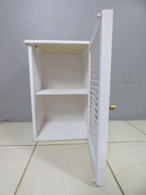 A stylish painted white pedestal w/ slatted door & large shelved cupboard. Lovely in all rooms!!