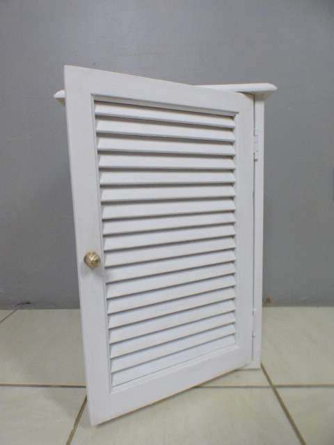 A stylish painted white pedestal w/ slatted door & large shelved cupboard. Lovely in all rooms!!