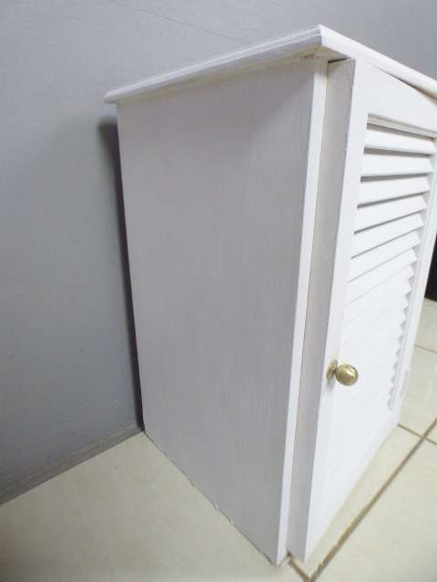 A stylish painted white pedestal w/ slatted door & large shelved cupboard. Lovely in all rooms!!