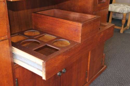 An extraordinary solid teak compact bar unit with solid green marble top and carved detailing