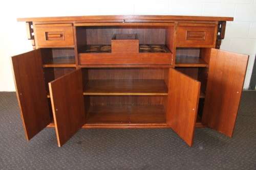 An extraordinary solid teak compact bar unit with solid green marble top and carved detailing