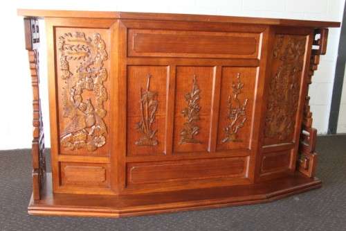 An extraordinary solid teak compact bar unit with solid green marble top and carved detailing