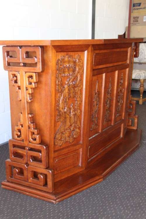 An extraordinary solid teak compact bar unit with solid green marble top and carved detailing