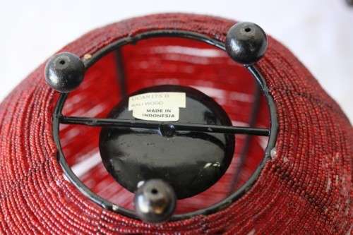 Two exquisite red beaded candle holders on a solid metal frame and metal feet; bid/holder