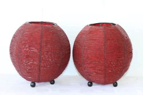 Two exquisite red beaded candle holders on a solid metal frame and metal feet; bid/holder