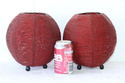 Two exquisite red beaded candle holders on a solid metal frame and metal feet; bid/holder