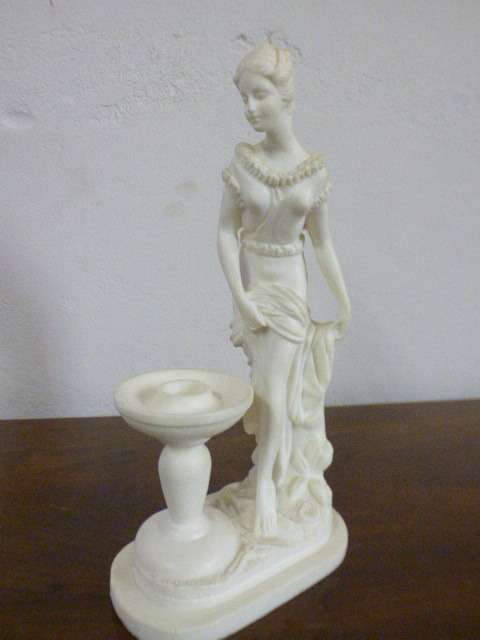 A lovely oxylite candle holder figurine of a lady in remarkable condition. Beautiful on display!!