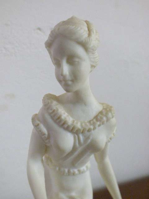 A lovely oxylite candle holder figurine of a lady in remarkable condition. Beautiful on display!!
