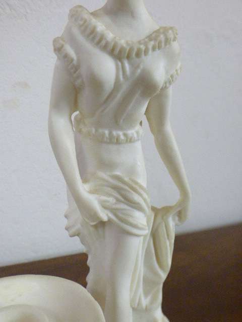 A lovely oxylite candle holder figurine of a lady in remarkable condition. Beautiful on display!!