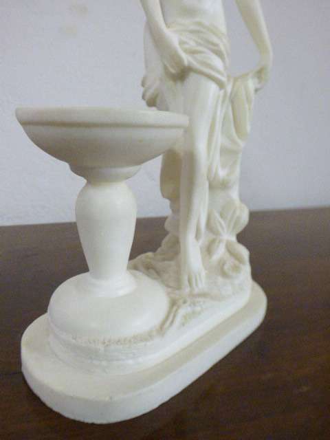 A lovely oxylite candle holder figurine of a lady in remarkable condition. Beautiful on display!!