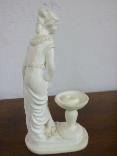 A lovely oxylite candle holder figurine of a lady in remarkable condition. Beautiful on display!!