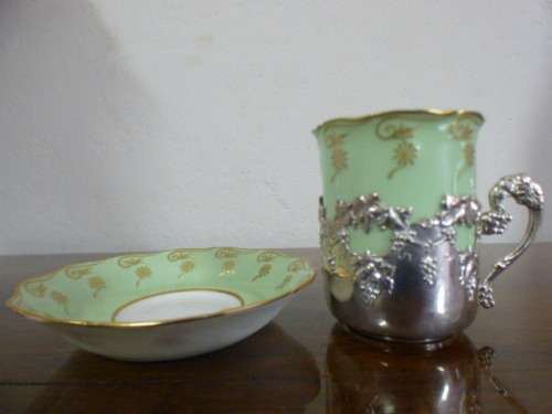 Magnificent boxed antique Royal Worcester demitasse duo's with gold detailing in silver cup holders!