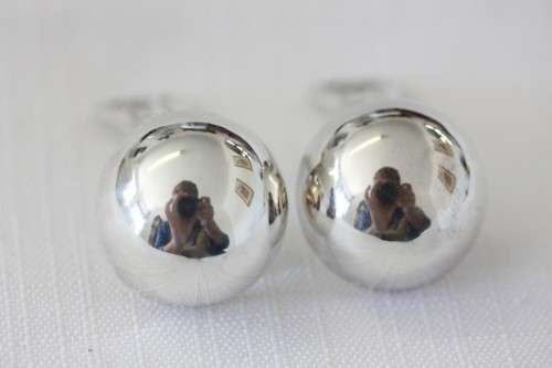 A magnificent pair of sterling silver stamped round clip-on earrings in remarkable condition