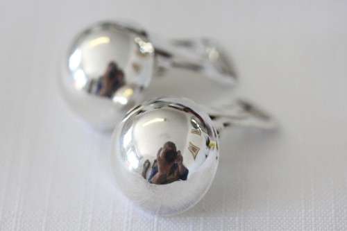 A magnificent pair of sterling silver stamped round clip-on earrings in remarkable condition