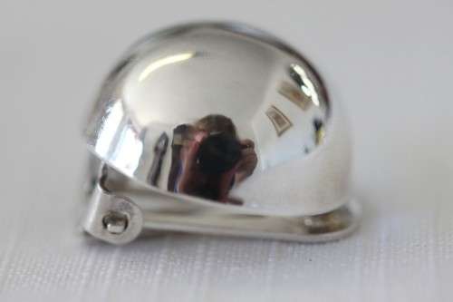 A magnificent pair of sterling silver stamped round clip-on earrings in remarkable condition