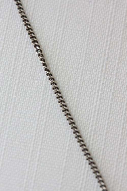 A stunning sterling silver (925) chain with a locket pendant and ornate detailing made in Italy
