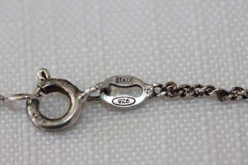 A stunning sterling silver (925) chain with a locket pendant and ornate detailing made in Italy