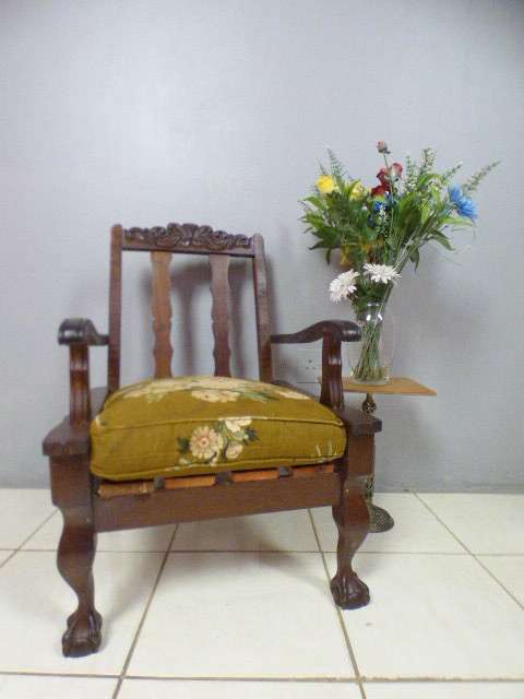 A gorgeous vintage Imbuia ball and claw hand carved arm chair, perfect in a sun room, patio, porch!!