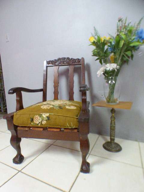 A gorgeous vintage Imbuia ball and claw hand carved arm chair, perfect in a sun room, patio, porch!!