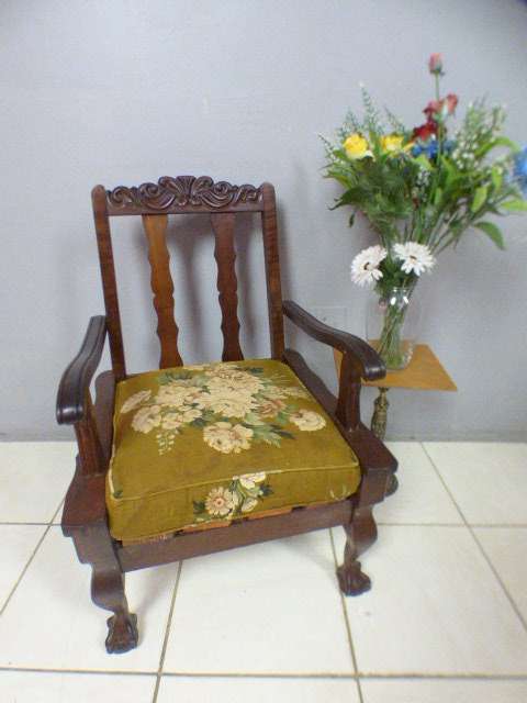 A gorgeous vintage Imbuia ball and claw hand carved arm chair, perfect in a sun room, patio, porch!!