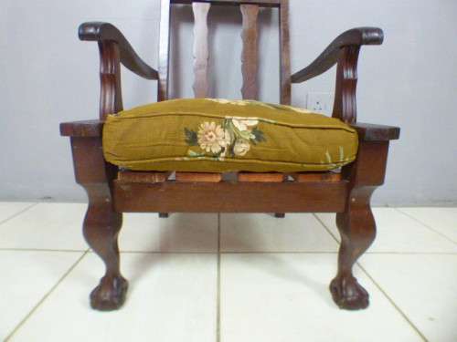 A gorgeous vintage Imbuia ball and claw hand carved arm chair, perfect in a sun room, patio, porch!!