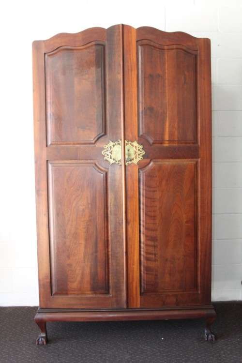 A stunning double-door solid Imbuia ball & claw wardrobe w/ solid brass embellishments & ample space