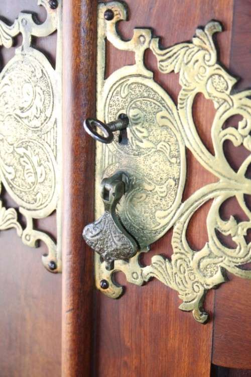 A stunning double-door solid Imbuia ball & claw wardrobe w/ solid brass embellishments & ample space