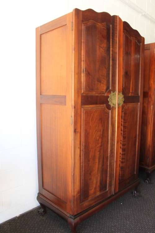 A stunning double-door solid Imbuia ball & claw wardrobe w/ solid brass embellishments & ample space