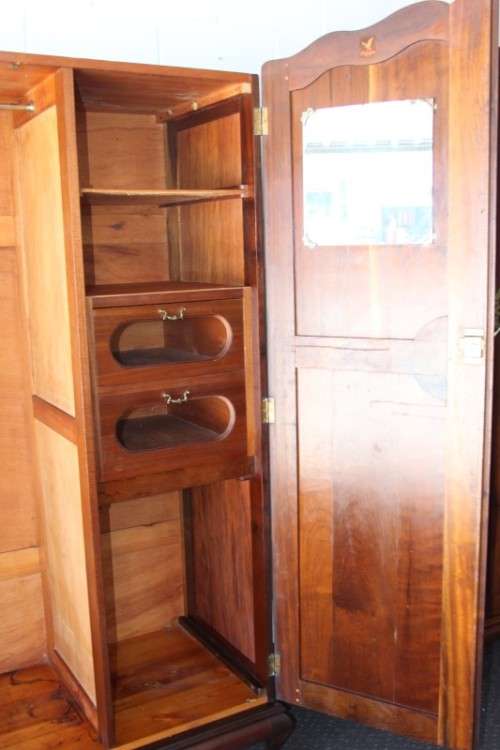 A stunning double-door solid Imbuia ball & claw wardrobe w/ solid brass embellishments & ample space