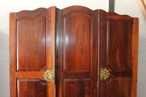 An incredible three-door solid Imbuia ball & claw wardrobe w/ solid brass embellishments