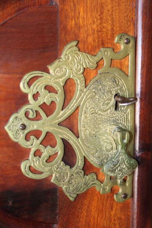 An incredible three-door solid Imbuia ball & claw wardrobe w/ solid brass embellishments