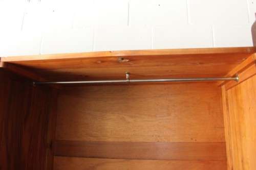 An incredible three-door solid Imbuia ball & claw wardrobe w/ solid brass embellishments