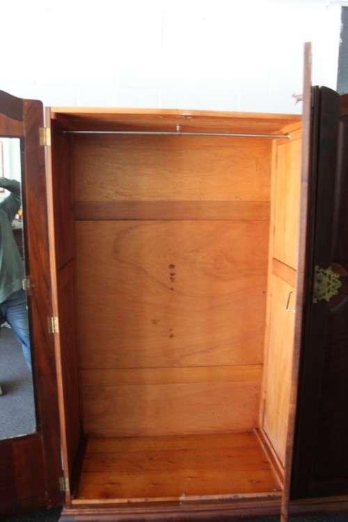 An incredible three-door solid Imbuia ball & claw wardrobe w/ solid brass embellishments