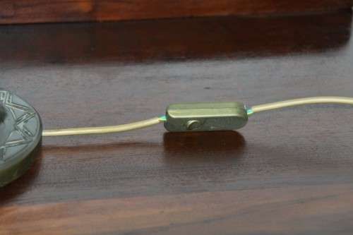 An exquisite tall "Leopard" moulded table lamp and shade with beautiful detailing in working order