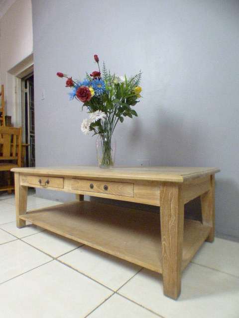 A superb (larger) light wood coffee table with four drawers - stunning!! - ideal for shabby chic too