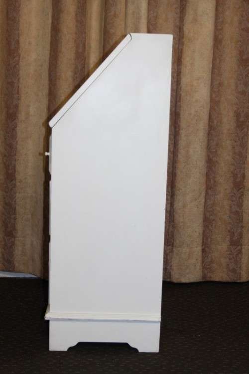 A stunning "eggshell" white flip-top writing desk with three large drawers and three smalls drawers