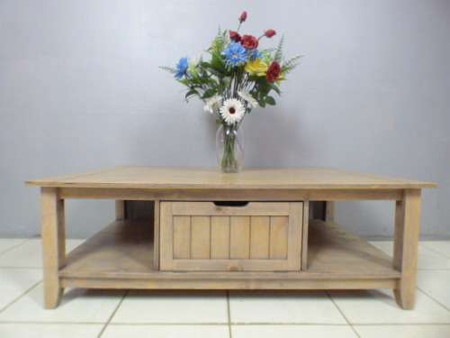 A lovely large centre coffee table w/ large cupboard in the middle; perfect to distress /shabby chic