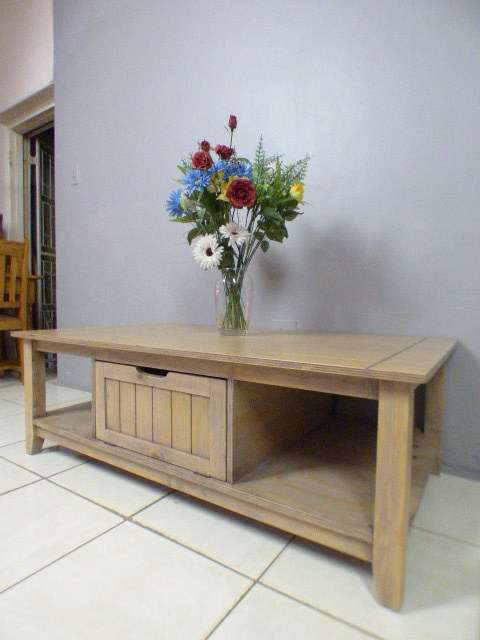 A lovely large centre coffee table w/ large cupboard in the middle; perfect to distress /shabby chic