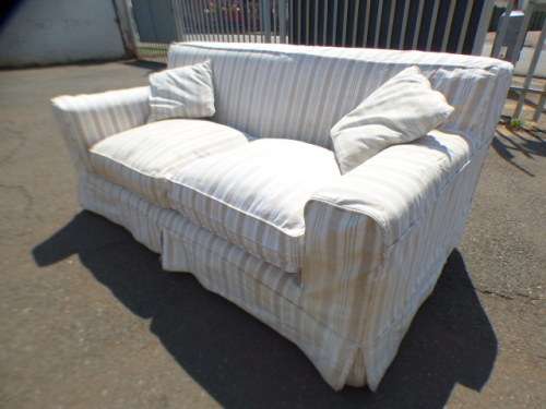A stunning large modern styled slip covered couch in great condition. Perfect in informal lounges!
