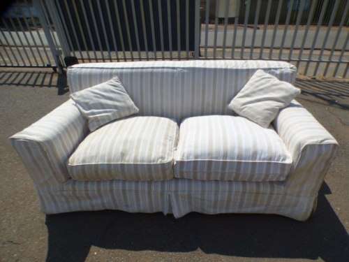A stunning large modern styled slip covered couch in great condition. Perfect in informal lounges!
