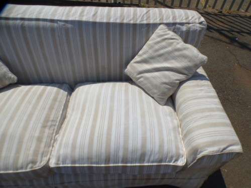 A stunning large modern styled slip covered couch in great condition. Perfect in informal lounges!