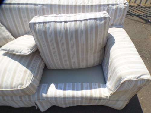 A stunning large modern styled slip covered couch in great condition. Perfect in informal lounges!
