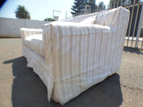 A stunning large modern styled slip covered couch in great condition. Perfect in informal lounges!