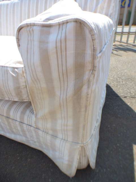 A stunning large modern styled slip covered couch in great condition. Perfect in informal lounges!