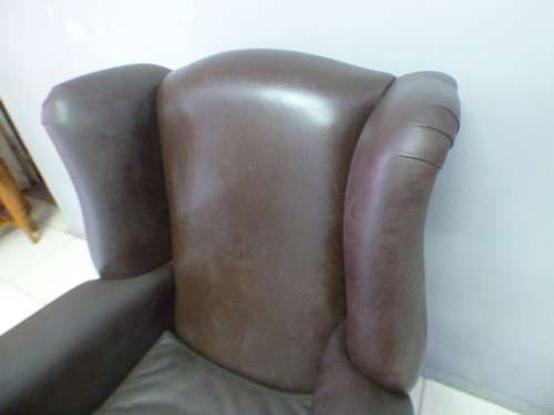An exquisite LGE genuine leather studded wing back chair.  Perfect in an executive office.