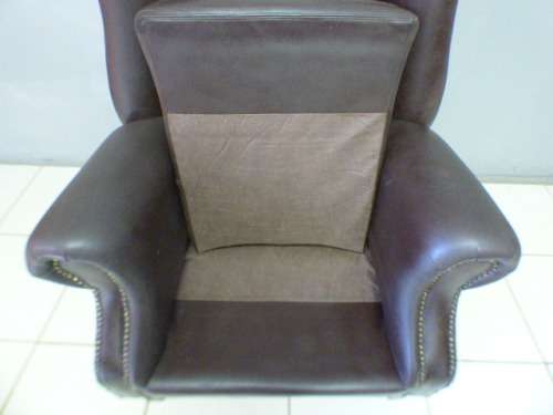 An exquisite LGE genuine leather studded wing back chair.  Perfect in an executive office.