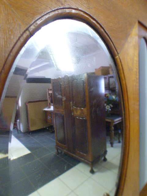 A stunning tall Teak hall stand with a beveled mirror, drawer and 6 hooks in great condition.