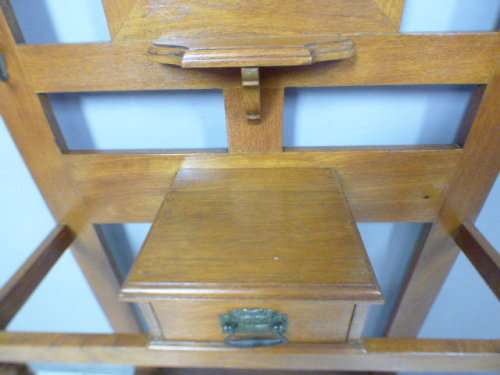 A stunning tall Teak hall stand with a beveled mirror, drawer and 6 hooks in great condition.