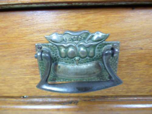 A stunning tall Teak hall stand with a beveled mirror, drawer and 6 hooks in great condition.